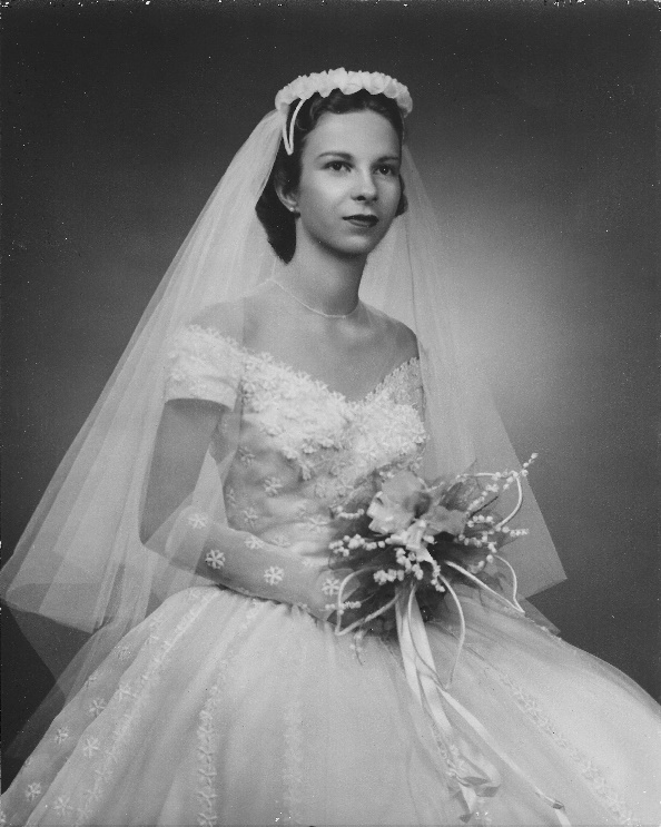 A person in a wedding dress

Description automatically generated